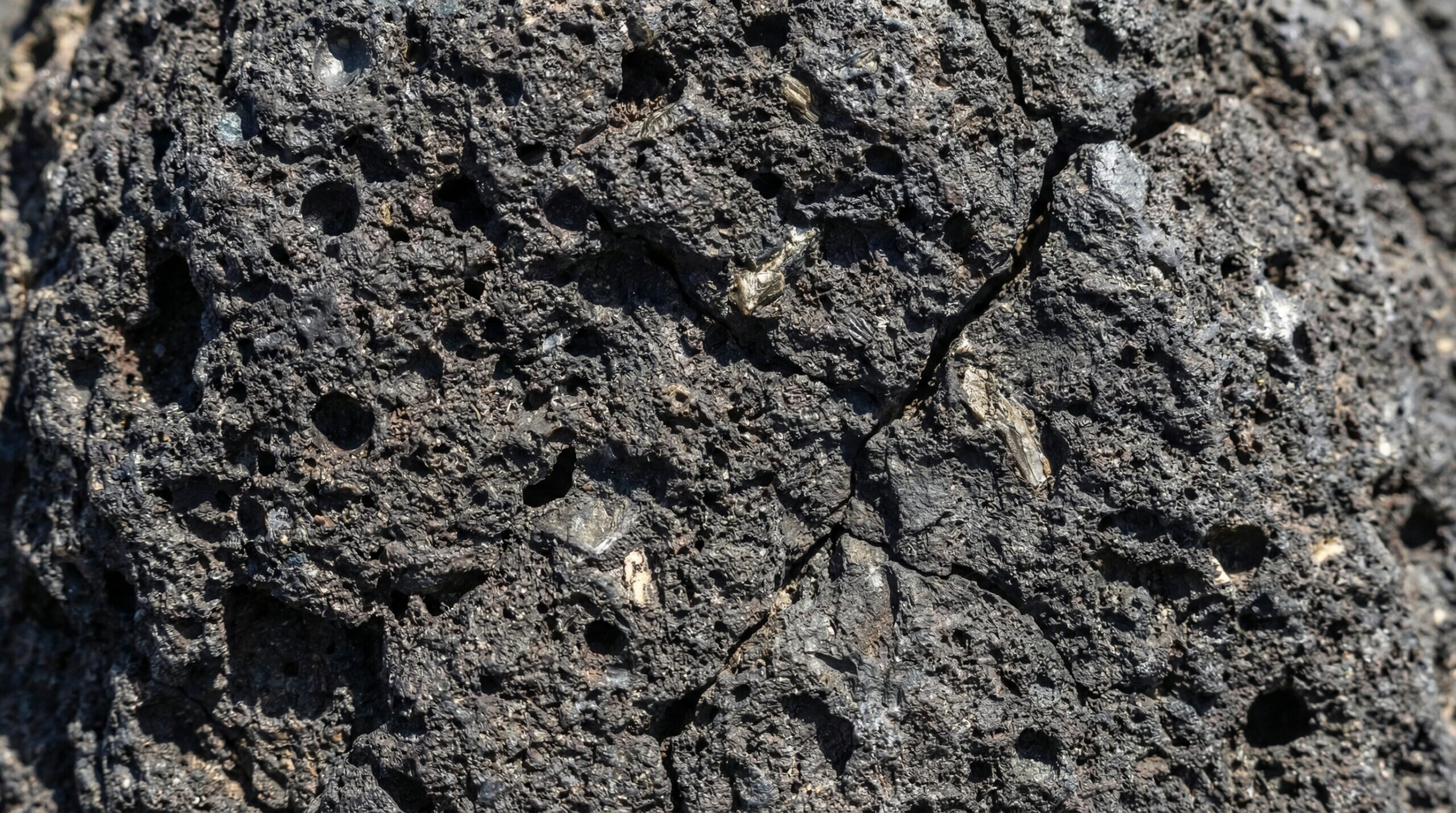 Close-up texture of basalt stone showing volcanic rock surface