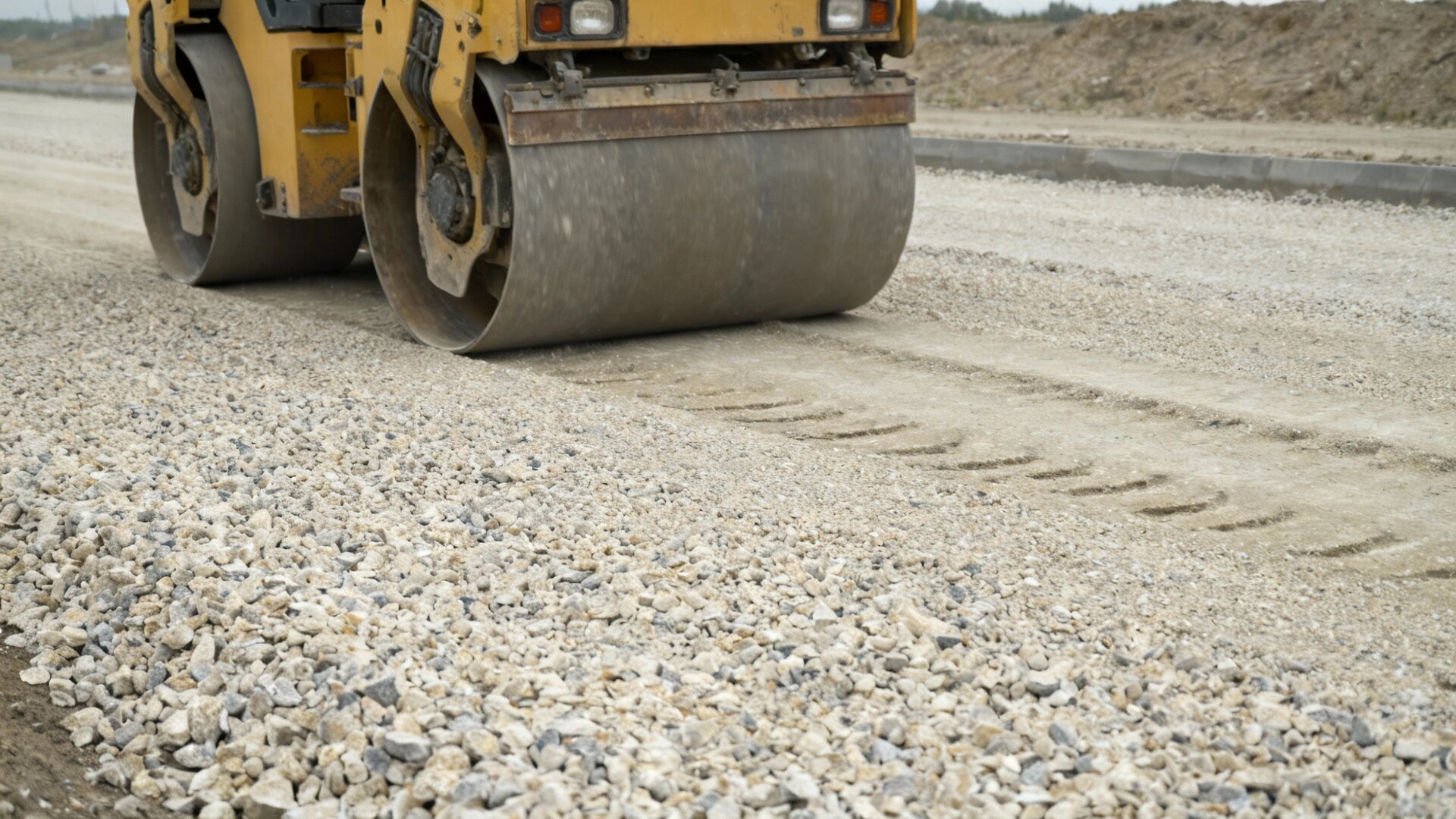 Crusher run limestone being compacted for road base construction