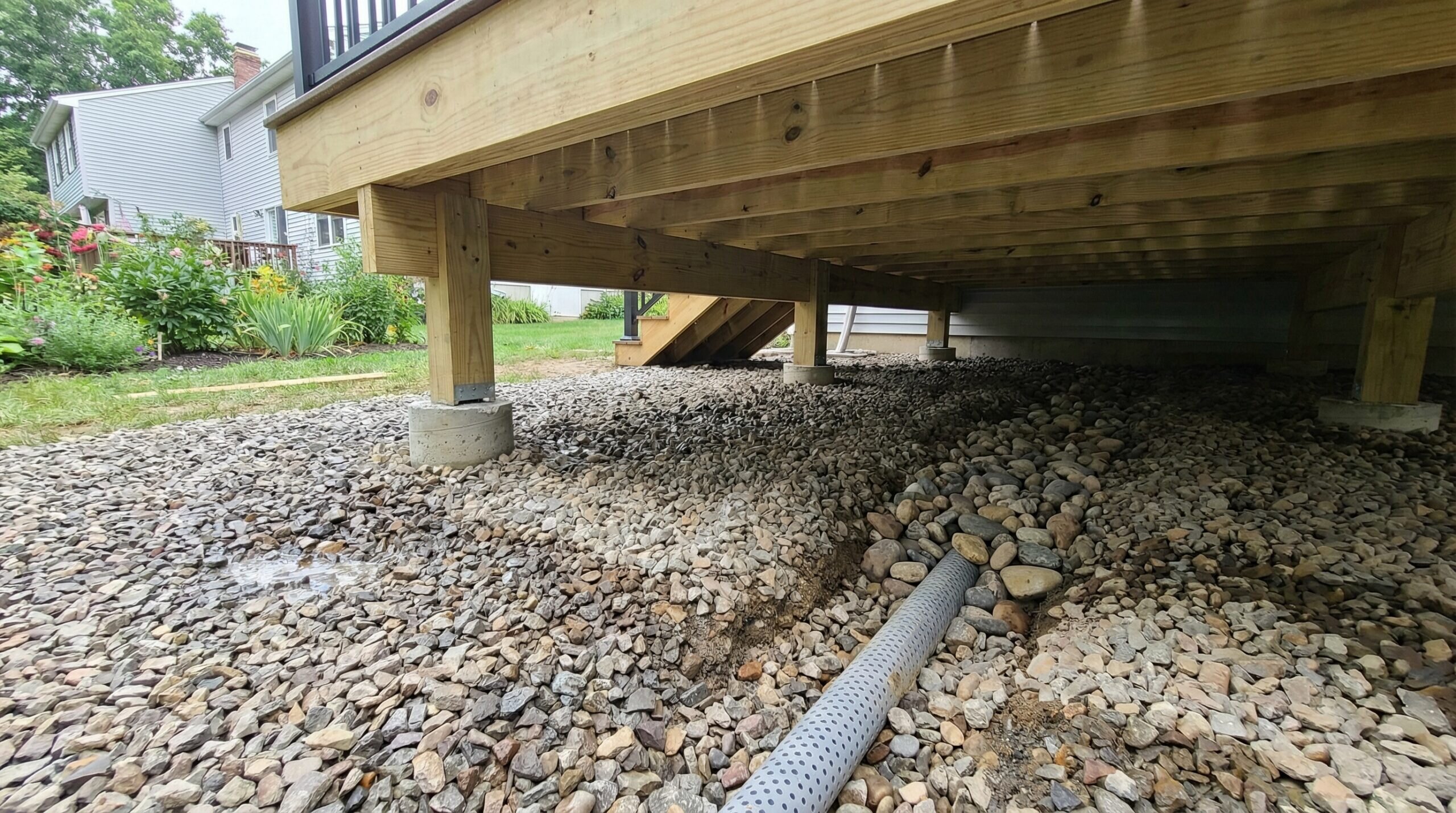 Deck with crushed stone foundation showing proper drainage