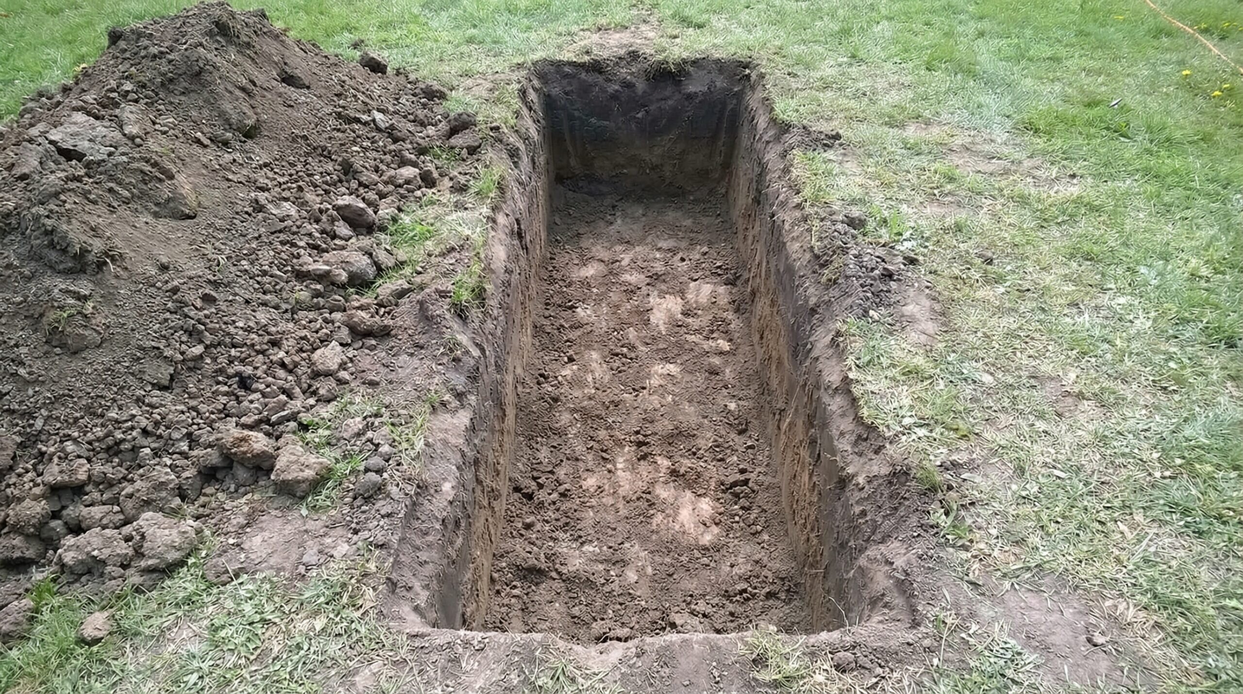 Step by step retaining wall base construction process