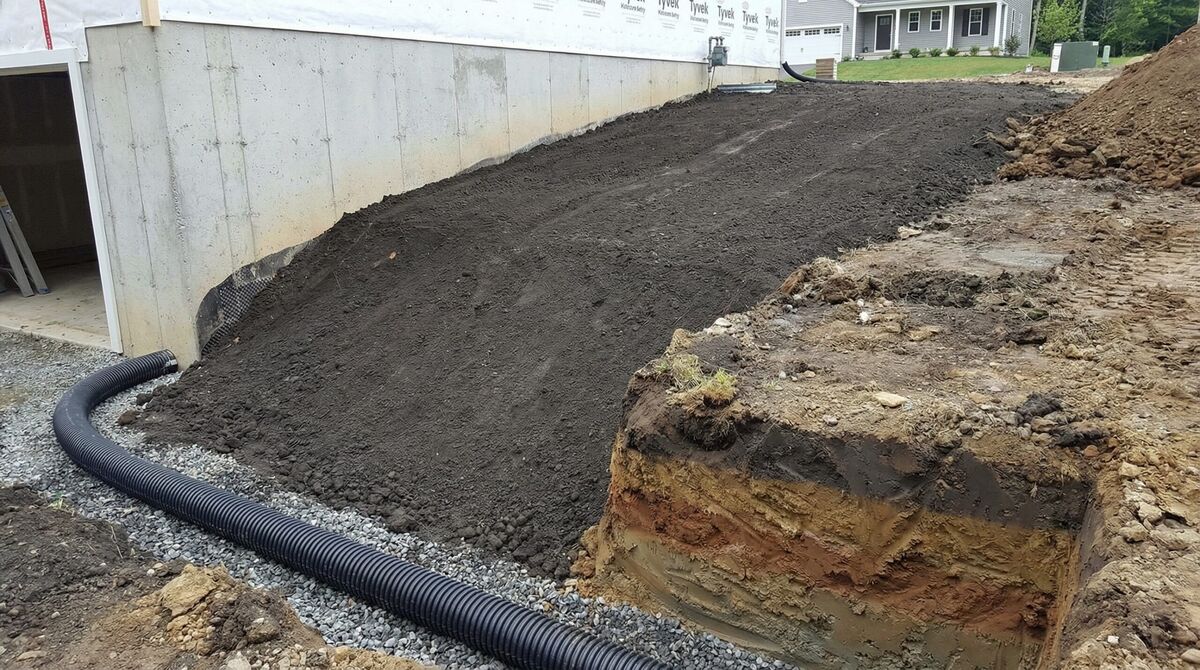 Foundation with proper fill dirt grading away from house